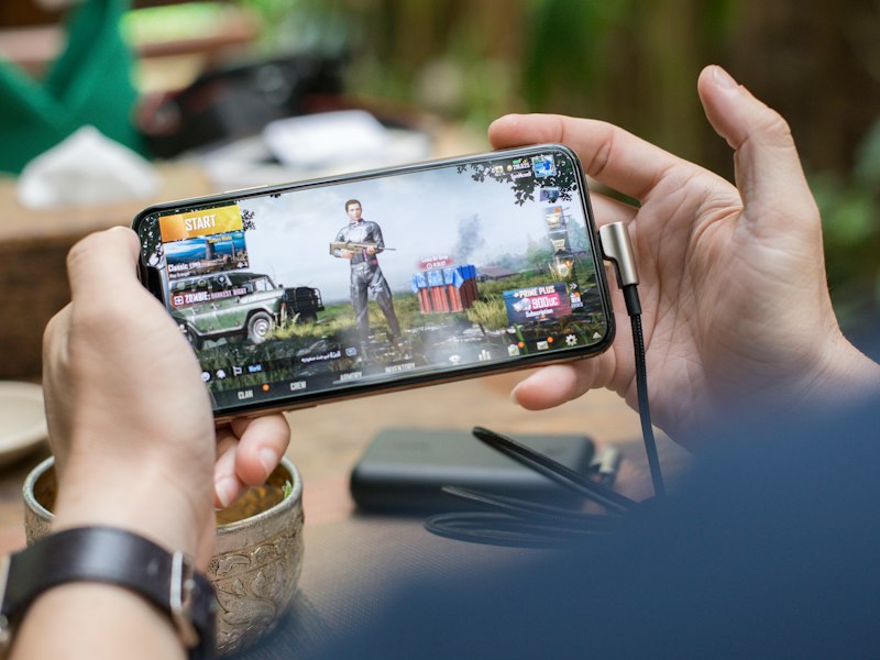 Coach reviewing match footage with a player